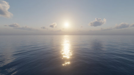 Experience the calming beauty of a serene sunrise over a tranquil ocean, with soft clouds reflecting the golden light on still waters.の素材