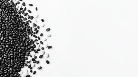 A visually appealing arrangement of black seeds scattered on a clean white surface. Ideal for healthy cooking or dietary content, showcasing organic ingredients.の素材