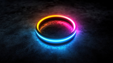 This image features a vibrant neon ring glowing softly against a dark background. The colorful illumination creates a captivating atmosphere, perfect for creative projects.の素材