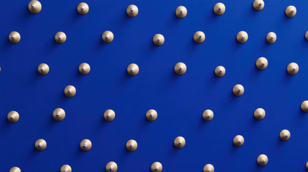 This image features a blue wall adorned with evenly spaced wooden balls, creating a striking abstract visual. Ideal for modern art or design themes.の素材