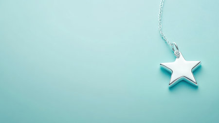 A stunning silver star pendant necklace resting gently on a soft blue background, perfect for showcasing stylish fashion accessories and elegance.の素材