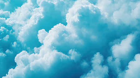 A stunning aerial view of soft and fluffy blue clouds against a clear sky, creating a serene atmosphere perfect for relaxation and inspiration.の素材