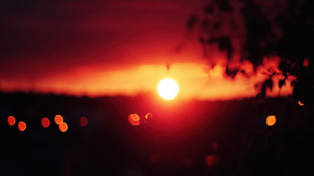 This stunning image captures a vibrant sunset with a beautiful interplay of colors and a dreamy bokeh effect, creating a serene and tranquil atmosphere.の素材