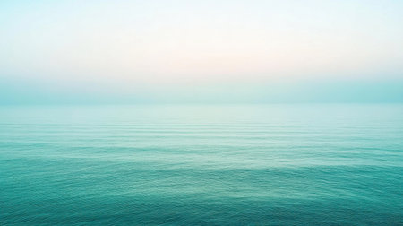 A serene view of gentle ocean waters under a soft pastel sky during dusk, creating a tranquil atmosphere perfect for relaxation and reflection.の素材