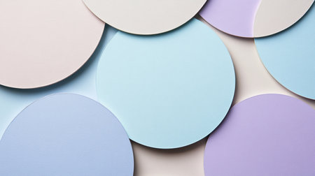 A visually appealing arrangement of colorful circular papers in pastel shades resting on a soft neutral background, ideal for artistic and design inspiration.の素材