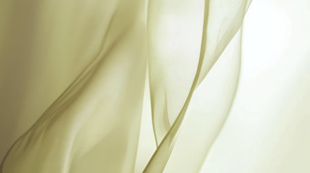 This captivating image showcases a soft and flowing fabric illuminated by natural light, creating a serene and elegant abstract background.の素材