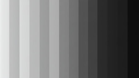 This abstract image features a smooth gradient transitioning from pure white to deep black, exhibiting a range of gray shades ideal for artistic backgrounds and design projects.の素材