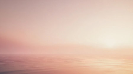 A tranquil pastel sunrise casts gentle hues of pink and orange over the calm water, creating a serene landscape that evokes peace and relaxation.の素材