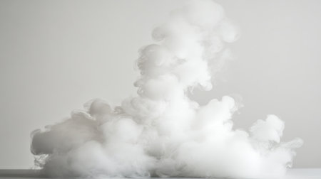 This image features a beautiful formation of white smoke rising against a gray background, creating ethereal shapes and depth ideal for various creative projects.の素材