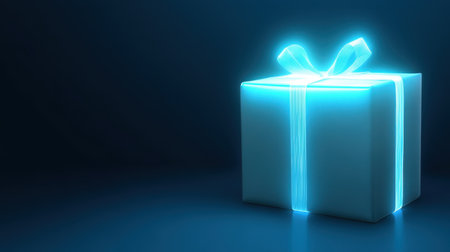 A glowing gift box tied with a blue ribbon, radiating a soft light against a dark background, perfect for holiday celebrations and special occasions.の素材