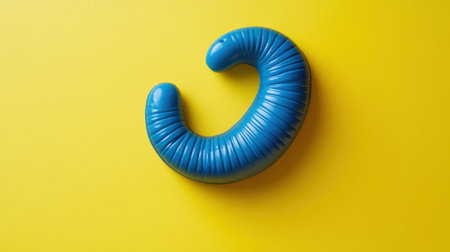This striking image features a vibrant blue curved shape on a bright yellow background, perfect for creative projects, graphic design, or modern art needs.の素材