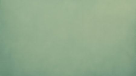 This soft green abstract background features a subtle texture, ideal for various design and artistic projects. Captures nature's tranquility and beauty.の素材