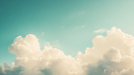 This image captures a beautiful sky filled with fluffy clouds against a soft blue background, evoking feelings of peace and tranquility in nature.の素材