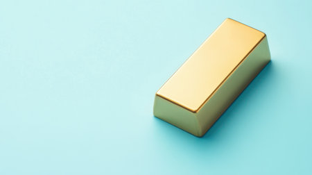 A shiny gold bar rests on a soft light blue background, symbolizing wealth and investment opportunities in a minimalistic yet striking design.の素材