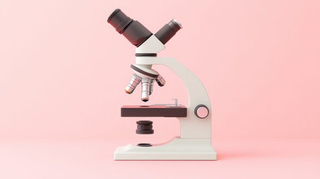 A classic microscope stands prominently against a soft pink background, ideal for scientific, educational, and research-themed projects, highlighting technology and observation.の素材