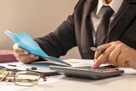 Business people or accountants who are reviewing financial documents and account books, work and financial ideas.の写真素材