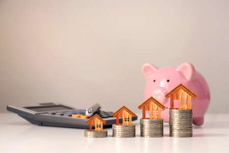 House model that is on the table top coin stack for finance and banking concept.の写真素材