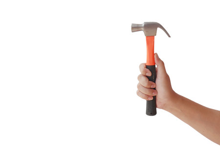 Human hands holding a hammer for repairs, isolated on a white backgroundの写真素材