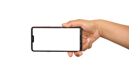 The hand is holding the white screen, the mobile phone is isolated on a white background.の写真素材