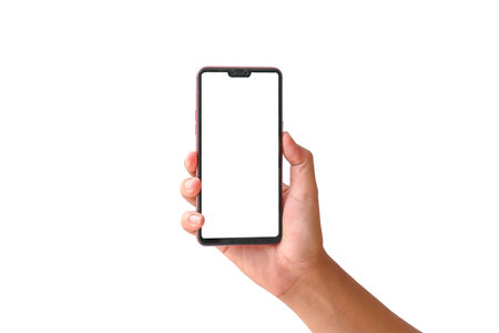 The hand is holding the white screen, the mobile phone is isolated on a white backgroundの写真素材