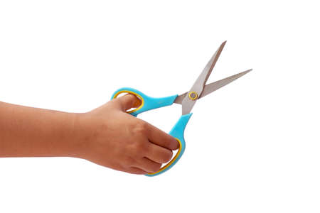 Hand is holding scissors isolated on a white backgroundの写真素材