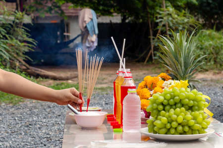 Incense sticks to worship the gods, including dining tables to worship the gods or spirits of ancestors, Asian superstitions.の写真素材