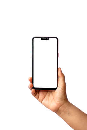 The hand is holding the white screen, the mobile phone is isolated on a white backgroundの写真素材