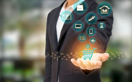 Close-up of business women holding icons for online shopping and online networking, business concepts and online marketing.の写真素材