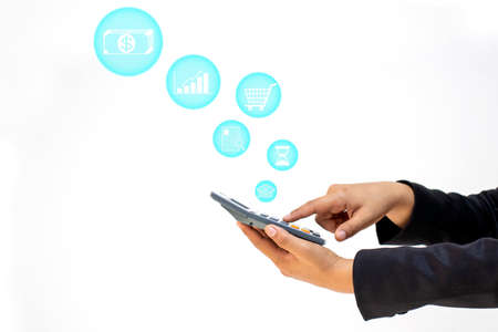 Business women who hold calculators and use calculators, including financial icons on a white background, financial concepts and financial accounting.の写真素材