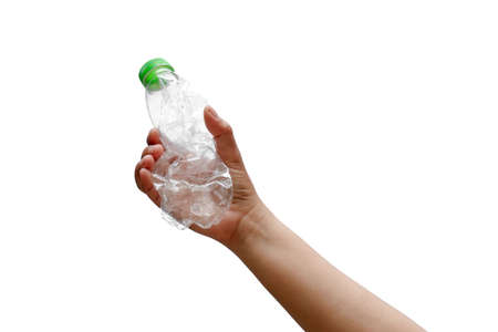 The hand holding a plastic bottle or recyclable waste isolated on a white background.