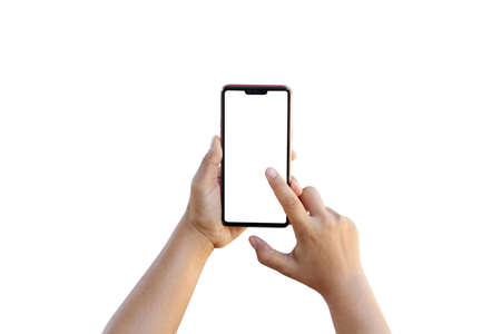 The hand is holding the white screen, the mobile phone is isolated on a white background.の写真素材
