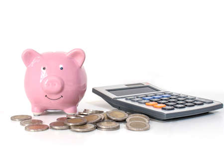 Pink piggy bank including money and calculator on white background, finance, and money-saving...
