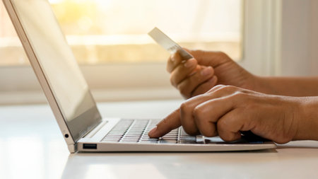 Hand of young women use laptop to shop online and transfer credit card money online banking concept.
