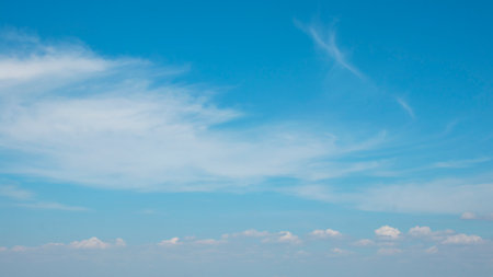 The blue sky with white clouds blur.