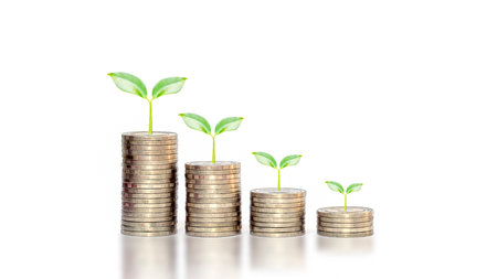 Plant growth on a falling pile of coins on white background financial idea in an economic downturn.の写真素材
