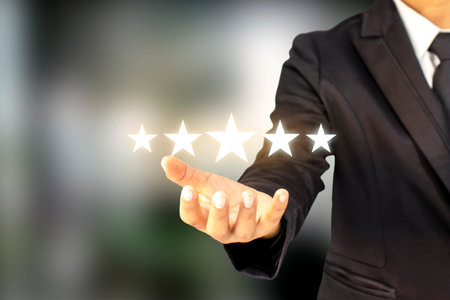 Businessmen are holding five stars, raising their rank or raising the highest ratings, best...