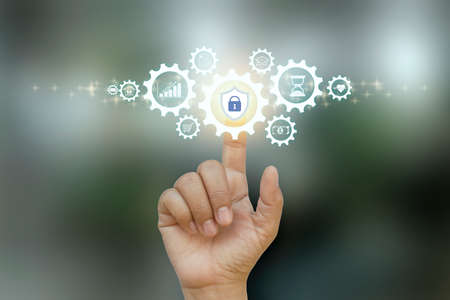 Business people clicking on protection icon internet business and financial security concept.の写真素材