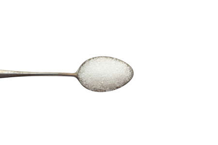 A teaspoon with sugar isolated on white background with top viewの写真素材