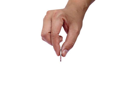 hand holding coin and coin holding gesture on white backgroundの写真素材