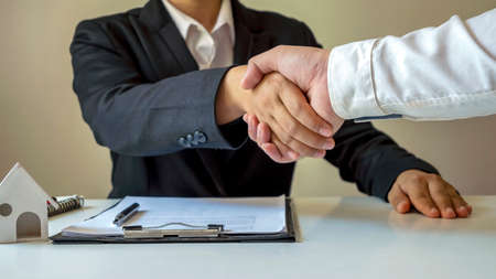 happy businessman handshake after contracting teamwork partnership