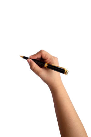 Close-up of a woman's hand holding a pen and writing gesture on a white background with the clipping path.の写真素材