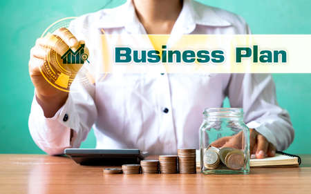 Businessman choosing growing graph icon and business plan text. Business planning ideas and strategies for business growth.の写真素材