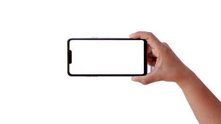 holding a smartphone with a color screen right with left hand isolated on white background with the clipping path.の写真素材