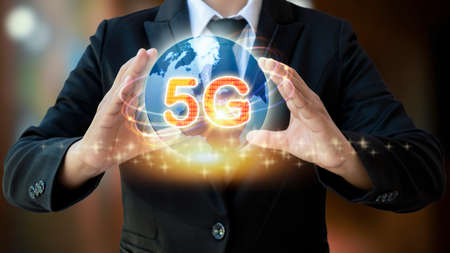 5g network icon and internet network in businessman's hands, 5G wireless networking concept.の写真素材