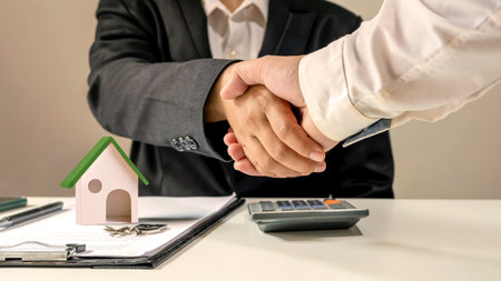 The businessmen finished the meeting and the happy businessman handshake after the contract was made to be a teamwork partner together.の写真素材