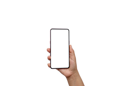 The hand is holding the white screen, the mobile phone is isolated on a white backgroundの写真素材