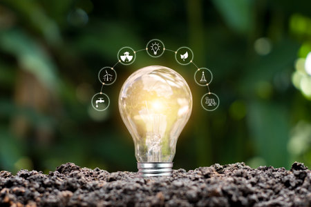 Light bulb with a ground energy source and icons for renewable energy. Renewable energy and ecology...