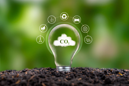 CO2 symbol on cloud in energy saving light bulb Concepts about the problems of carbon dioxide emissions and energy use that affect nature.の写真素材