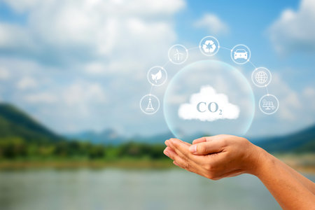 CO2 symbol on a cloud in a human hand regarding the issue of carbon dioxide emissions and their impact on nature.の写真素材