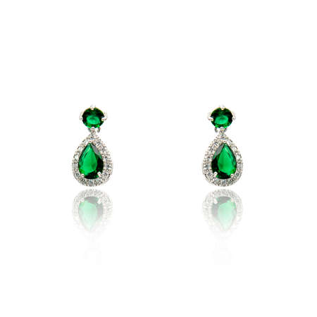 Pair of emerald earrings isolated on white backgroundの写真素材